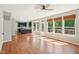 Bright and spacious living room next to kitchen boasts hardwood floors and sunlit windows at 7388 Wythe Dr, Noblesville, IN 46062