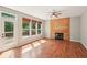 Bright living room featuring a fireplace, ceiling fan, and access to a deck at 7388 Wythe Dr, Noblesville, IN 46062