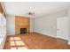 Open living room with hardwood floors, a fireplace, and neutral paint at 7388 Wythe Dr, Noblesville, IN 46062