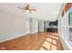 Open floor plan: bright living space, hardwood floors, and views of modern kitchen at 7388 Wythe Dr, Noblesville, IN 46062