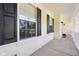 Inviting covered porch with black shutters and space for outdoor decor at 7388 Wythe Dr, Noblesville, IN 46062