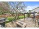 A backyard featuring both a wood deck with a fire pit, and a concrete patio with a pergola at 745 N Madison St, Fortville, IN 46040