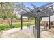 Open patio area in the backyard with a pergola, outdoor seating, and green space at 745 N Madison St, Fortville, IN 46040