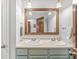 Bathroom with a double sink vanity, framed mirror and neutral decor at 745 N Madison St, Fortville, IN 46040
