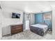 Cozy bedroom with large window, soft blue accent wall, and modern furnishings at 745 N Madison St, Fortville, IN 46040
