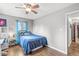 Bedroom featuring hardwood floors, modern lighting, desk, and closet at 745 N Madison St, Fortville, IN 46040