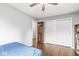 Bedroom featuring hardwood floors, modern lighting and a closet at 745 N Madison St, Fortville, IN 46040