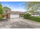 Traditional brick ranch featuring an attached two-car garage and a well-maintained front yard at 745 N Madison St, Fortville, IN 46040