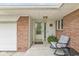 Inviting covered entry with a cozy seating area, perfect for enjoying quiet moments outside at 745 N Madison St, Fortville, IN 46040