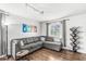 Cozy living room featuring a comfortable sectional sofa, stylish decor, and natural light, creating a relaxing ambiance at 745 N Madison St, Fortville, IN 46040