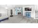 Cozy living room featuring plush sofa, fireplace, and a mounted television at 745 N Madison St, Fortville, IN 46040