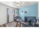 A home office with a desk, rug, a window and accent wall at 745 N Madison St, Fortville, IN 46040