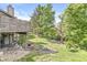 Beautiful backyard view with mature trees surrounding a deck with stairs to the yard and barbecue at 8047 Van Ness Way, Indianapolis, IN 46240