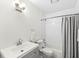 Modern bathroom with tiled shower, tub, and vanity at 8047 Van Ness Way, Indianapolis, IN 46240