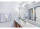 Bright bathroom featuring a single sink vanity, framed mirror, and white painted walls at 8047 Van Ness Way, Indianapolis, IN 46240