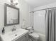 Modern bathroom with a sleek vanity, white subway tile, and a shower-tub combo at 8047 Van Ness Way, Indianapolis, IN 46240
