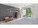Bedroom with a chalkboard wall, access to the backyard, and a comfortable bed at 8047 Van Ness Way, Indianapolis, IN 46240