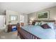 Comfortable bedroom featuring a full bath, carpeted floor, and relaxing decor at 8047 Van Ness Way, Indianapolis, IN 46240