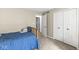 Neutral bedroom with closet and adjoining door at 8047 Van Ness Way, Indianapolis, IN 46240