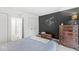 Bedroom with a chalkboard wall and comfortable queen bed at 8047 Van Ness Way, Indianapolis, IN 46240