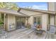Outdoor deck with a sliding glass door to the home and wood storage at 8047 Van Ness Way, Indianapolis, IN 46240