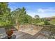 Spacious outdoor deck with multiple seating arrangements and scenic views overlooking a large manicured lawn at 8047 Van Ness Way, Indianapolis, IN 46240