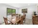Cozy dining room with wood table, chairs, and sliding glass door to the deck at 8047 Van Ness Way, Indianapolis, IN 46240