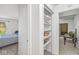 Hallway with a linen closet stocked with towels, and a view into a bedroom at 8047 Van Ness Way, Indianapolis, IN 46240