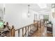 Bright hallway with chandelier and wooden railing stairs at 8047 Van Ness Way, Indianapolis, IN 46240