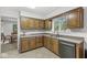 This kitchen offers plenty of cabinet space and stainless steel dishwasher at 8047 Van Ness Way, Indianapolis, IN 46240