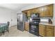 Well-equipped kitchen with stainless steel refrigerator and dark range at 8047 Van Ness Way, Indianapolis, IN 46240