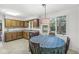 Cozy kitchen features bright natural light, wood cabinets, and an eating area at 8047 Van Ness Way, Indianapolis, IN 46240