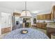 Kitchen with a cozy breakfast nook, warm wooden cabinets, and stainless steel refrigerator at 8047 Van Ness Way, Indianapolis, IN 46240