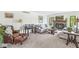 Comfortable living room with a fireplace and large windows for natural light at 8047 Van Ness Way, Indianapolis, IN 46240