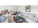 Bright living room with multiple seating options, open floorplan, and skylight at 8047 Van Ness Way, Indianapolis, IN 46240