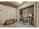 Home office area with wood paneling, neutral carpet and a desk at 8047 Van Ness Way, Indianapolis, IN 46240