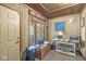 Cozy office space with wood paneled walls, large window, and vintage furniture at 8047 Van Ness Way, Indianapolis, IN 46240