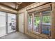 Cozy sun room featuring many windows and access to the backyard at 8047 Van Ness Way, Indianapolis, IN 46240