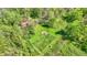 Well manicured yard boasts a fenced garden area and a fire pit for relaxation at 8820 Mud Creek Rd, Indianapolis, IN 46256