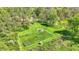Well manicured yard features a fenced garden area and a fire pit for relaxation at 8820 Mud Creek Rd, Indianapolis, IN 46256