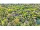 Enjoy the privacy of a secluded property nestled among mature trees, as seen from above at 8820 Mud Creek Rd, Indianapolis, IN 46256