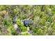Enjoy the privacy of a secluded property nestled among mature trees, as seen from above at 8820 Mud Creek Rd, Indianapolis, IN 46256