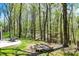 Serene backyard with a stone fire pit, offering a cozy space for outdoor gatherings and relaxation at 8820 Mud Creek Rd, Indianapolis, IN 46256