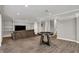 Finished basement area with wood-look floors, shelving and a comfy sofa at 8820 Mud Creek Rd, Indianapolis, IN 46256