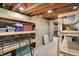 Unfinished basement with concrete block walls and rows of shelving at 8820 Mud Creek Rd, Indianapolis, IN 46256