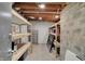 Unfinished basement with exposed wood ceiling and rows of shelving at 8820 Mud Creek Rd, Indianapolis, IN 46256