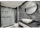 Sleek bathroom with a glass-enclosed shower, modern vanity, and stylish fixtures at 8820 Mud Creek Rd, Indianapolis, IN 46256