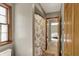 Bathroom features a shower, floral shower curtain, and is attached to a bedroom with connecting doorway at 8820 Mud Creek Rd, Indianapolis, IN 46256