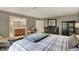Bedroom featuring stylish decor, including a chair, bed, dressers, and natural light at 8820 Mud Creek Rd, Indianapolis, IN 46256