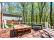 Wooden deck equipped with a hot tub and seating area, perfect for relaxation outdoors at 8820 Mud Creek Rd, Indianapolis, IN 46256